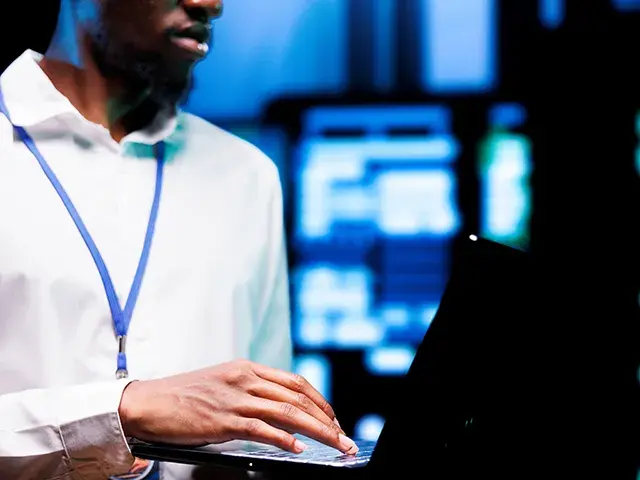 Male technician with laptop