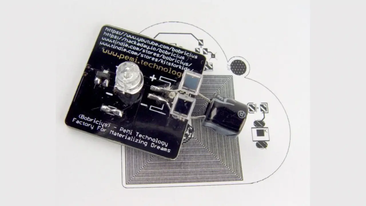 Bobricius’ Solar-powered flashing LED heart pendant PCB coil project. Front side.