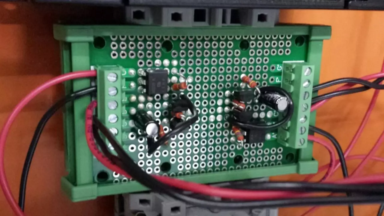 Figure 1: Stephen’s din rail mounted PCB with his circuit on it. It converts the PWM signal from a MCU to an analog signal that the motor controller can use.