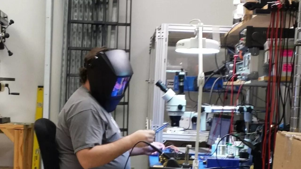 Figure 1: Parker dons a welding helmet to prevent himself from going blind while testing some super bright LEDs.