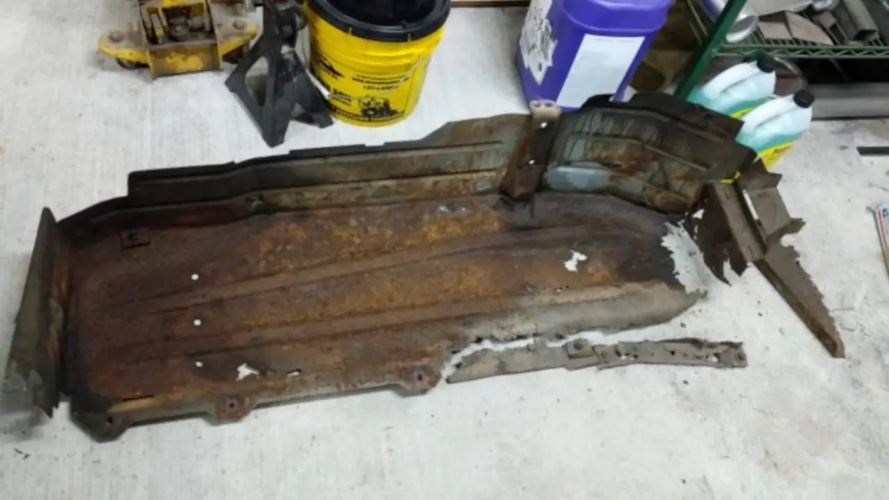Rusted out gas tank skid plate off of Parker’s Wagon.