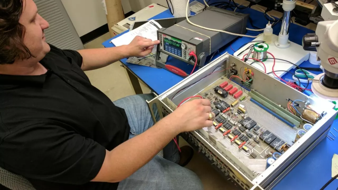 Figure 1: Stephen working on his Voltage Standard with the DMM7510.